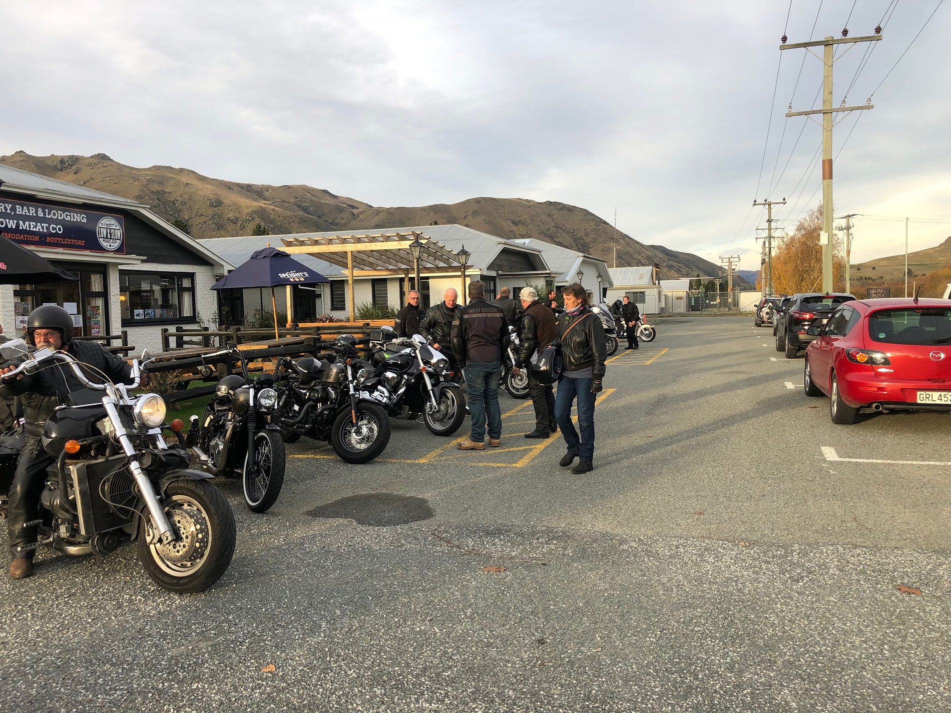 The Best Dam Pub from the street, with a row of motorbikes and riders parked out front